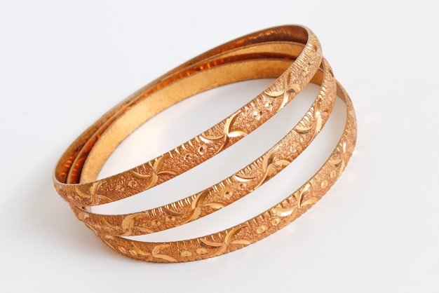 Gold bangle isolated on white background Celebrity lifestyle accessories Crazy rich lifestyle Mod