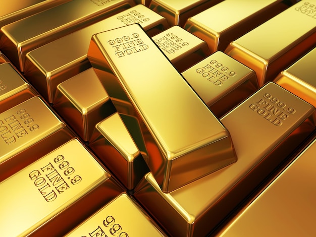 Gold bars are stacked in a pile.