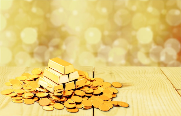 Gold bars and coins on backgrouund