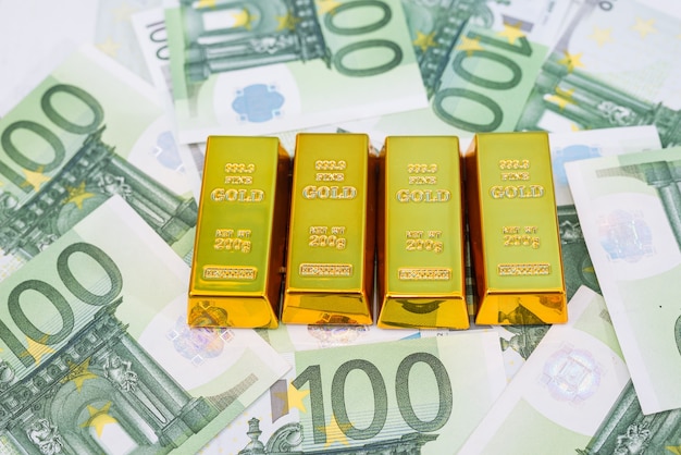 Gold bars on euro banknotes.financial wealth or savings concept.