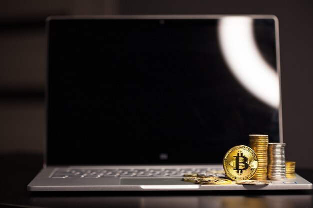 Gold bitcoin on a dark background