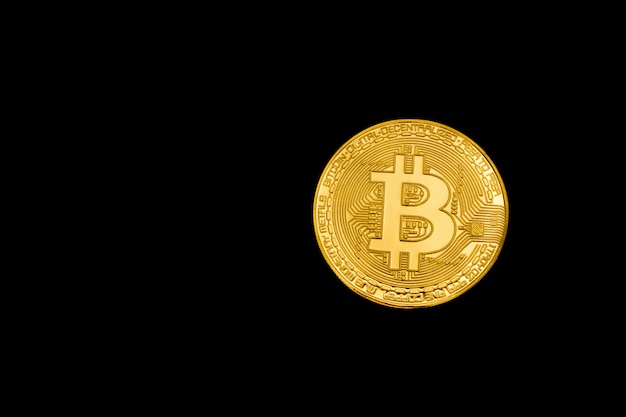 Gold bitcoin on dark surface