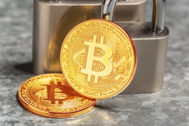 Gold bitcoin and padlock