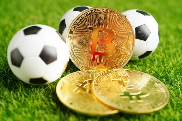 Gold bitcoin with soccer ball or football cryptocurrency used in online sports betting