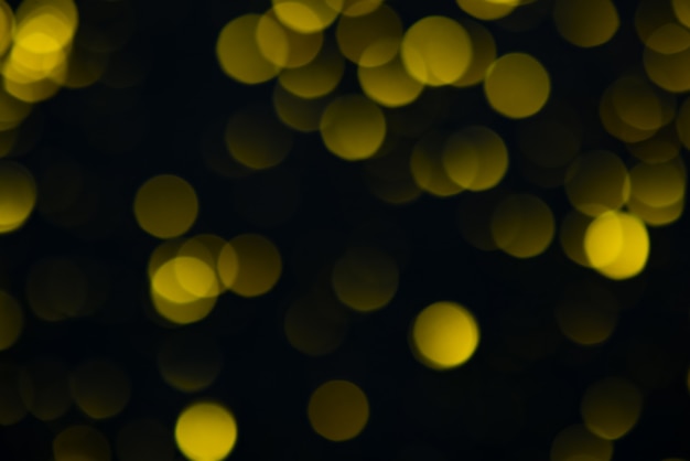 Gold bokeh on black background