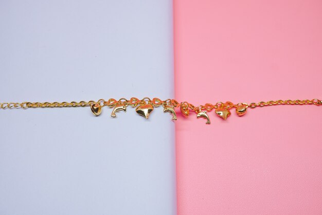 gold bracelet with love and dolphin motif