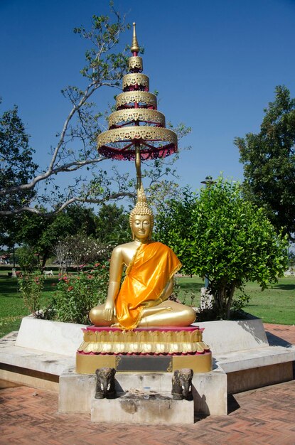 Gold buddha statue in garden at outdoor of Wat Niwet Thammaprawat Ratchaworawihan for people praying on December 19 2016 in Phra Nakhon Si Ayutthaya Thailand
