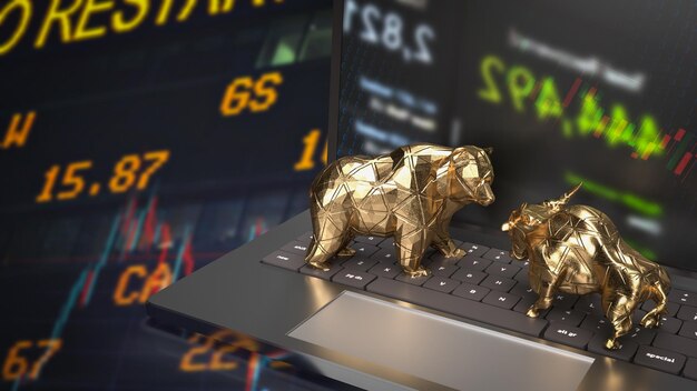 The gold bull and bear on notebook for business concept 3d rendering