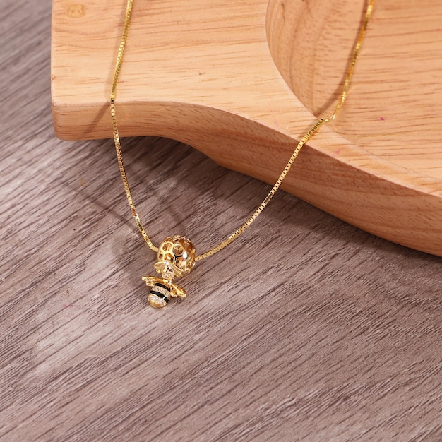 Photo gold chain necklace on the background wood