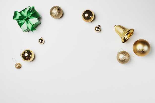 Gold christmas ornaments on a white background