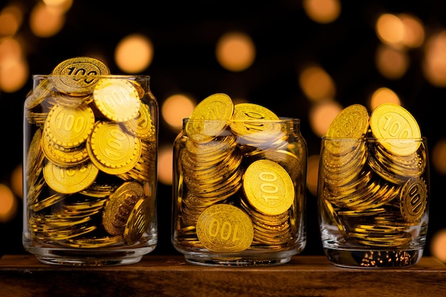 Gold coin in glass bottle money saving concept and gold savings