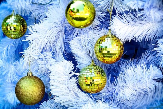 Gold Decorative Balls on White Christmas Tree