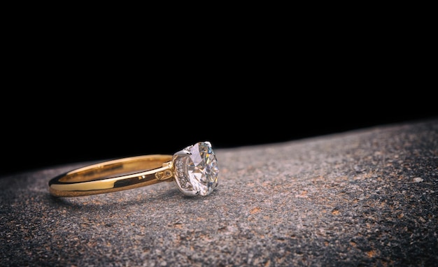 Gold Engagement Diamond Ring on Natural Stone