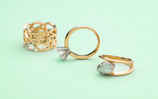 Gold Engagement Diamond Ring on Turquoise Background