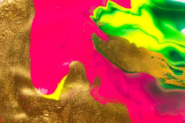 蛍光ピンクの部分と金箔の抽象的な背景
