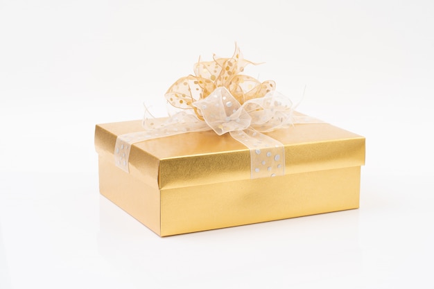 Gold gift box on white