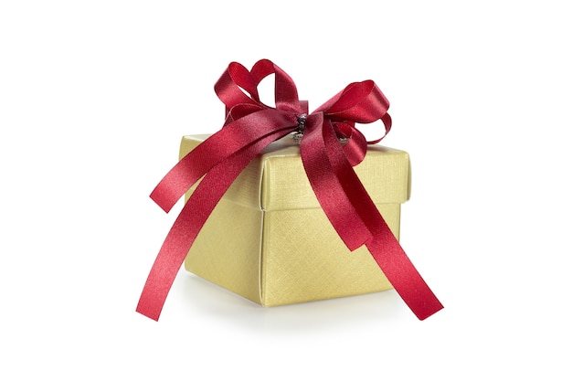 Gold gift box with red ribbon