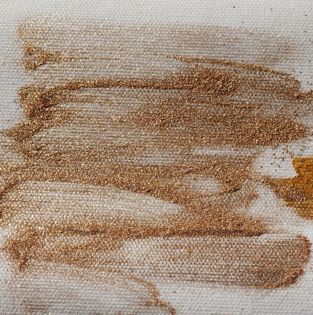 Gold glitter texture on canvas