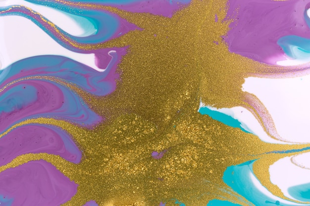 Gold glitter waves on liquid acrylic background marble blue and purple abstract