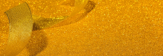 Gold glittery ribbon with copy space