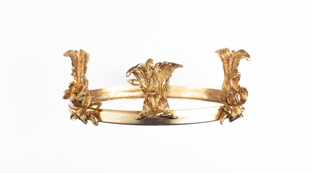 A gold headband with a bird motif on it.