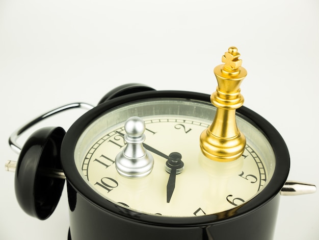 Gold King of chess on alarm clock 