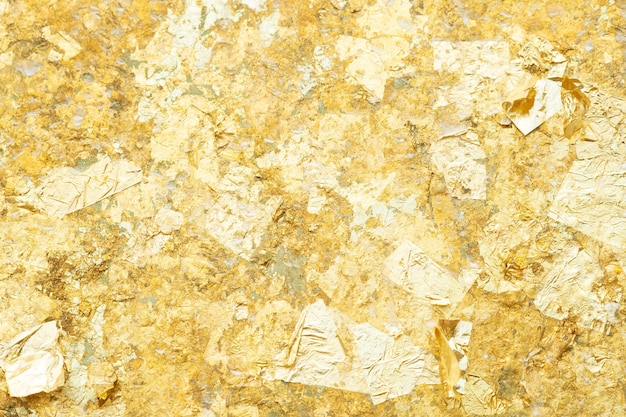 Foto foglia d'oro sullo sfondo del muro