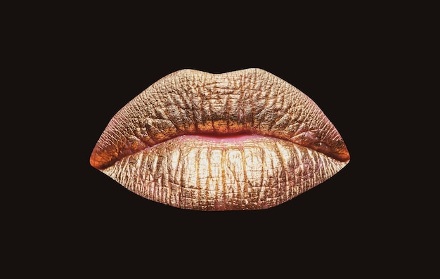 Gold lips woman wouth close up with golden color lipstick on\
lip glitter glossy lips biting