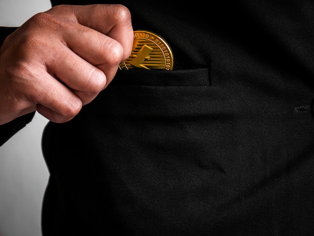 Gold litecoin was placed in the black suit