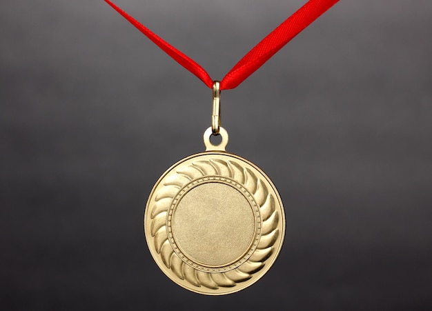 Gold medal on grey background