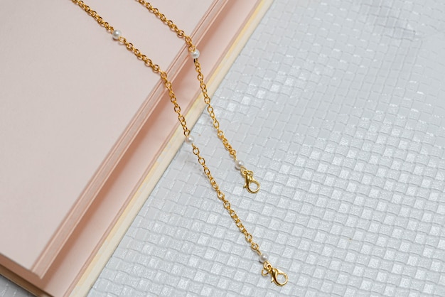 Gold necklace in white background