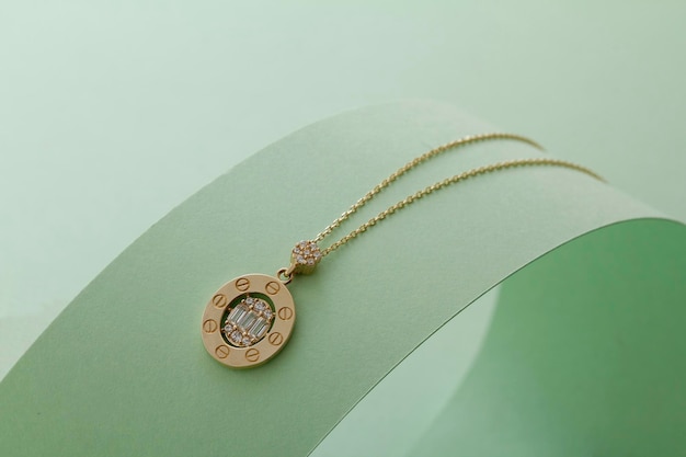 A gold necklace with a diamond pendant from the brand bulgari.