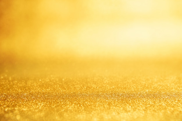 Gold New year background abstract, Yellow glitter bokeh vintage lights, defocused.