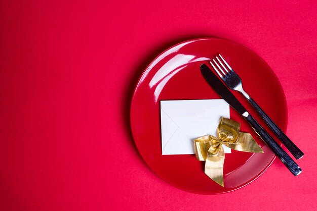 Gold ribbon on red plate.