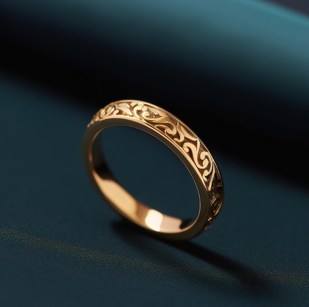 A gold ring with a floral pattern on it