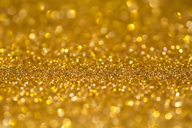 Photo gold sequins shine bright yellow powder glitter and bokeh lights