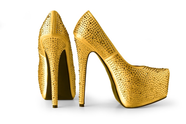 Gold shoes isolated on whete