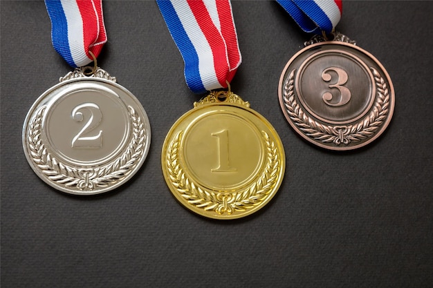 Gold silver and bronze medals set on black background Sports athletes winners prize