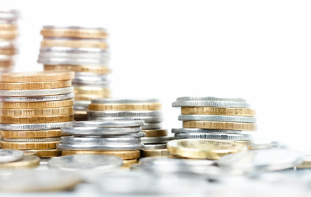 Gold and silver coins in stacks closeup