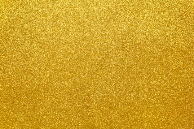 Gold sparkling festive background, close-up