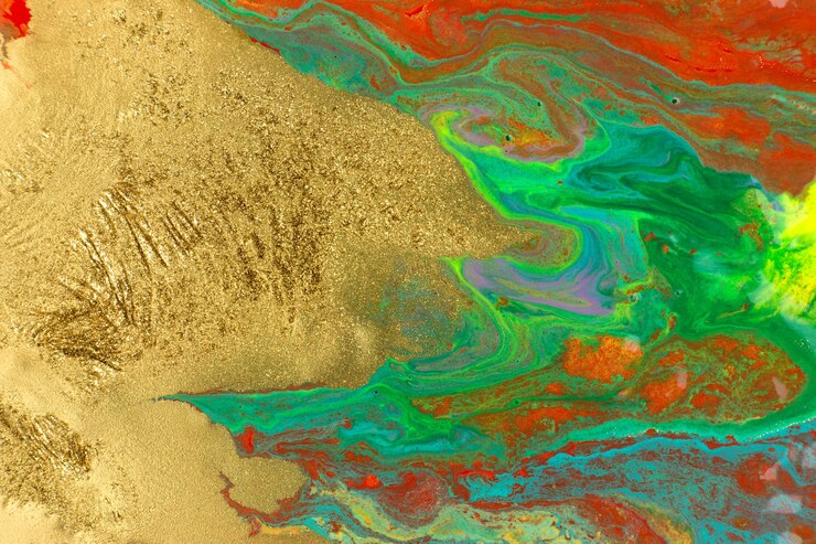 Photo gold spots on red and green smudges of paint abstract pattern