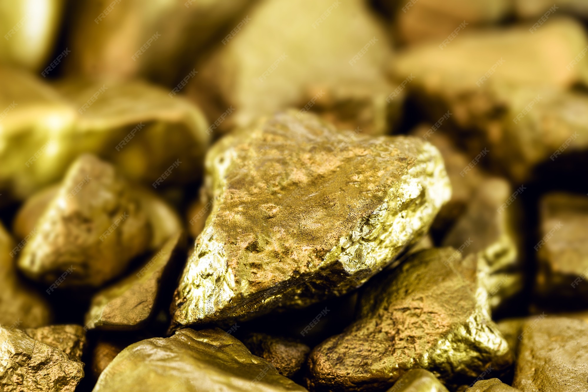 Premium Photo | Gold stones, rough gold nuggets on black surface.