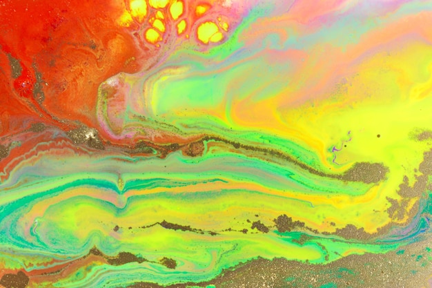 Золотая текстура на фоне потока флуоресцентных красок