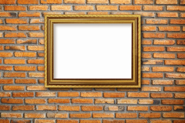 Gold vintage photo frame on red brick wall