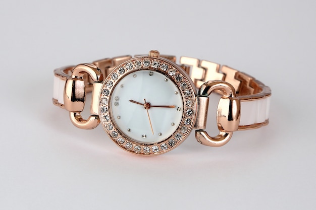 Gold watch with rhinestones .