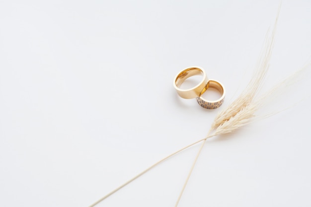 Gold wedding rings are decorated with wheat stem