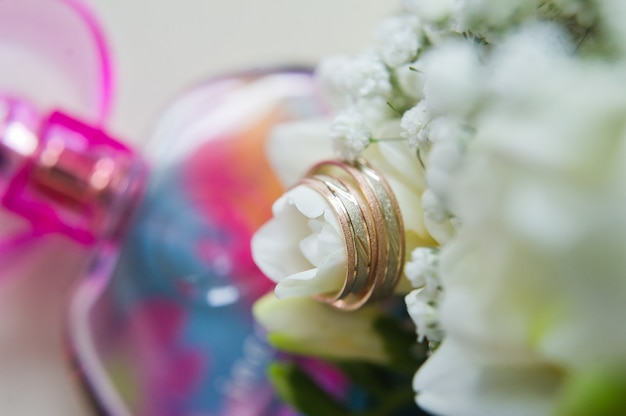 Gold wedding rings for the bride and groom.