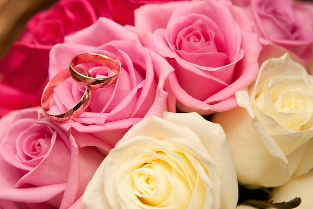 Gold wedding rings on flower