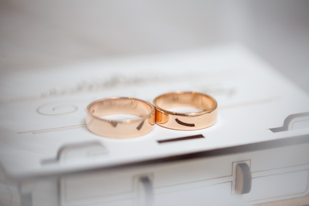 Gold wedding rings for newlyweds on wedding day