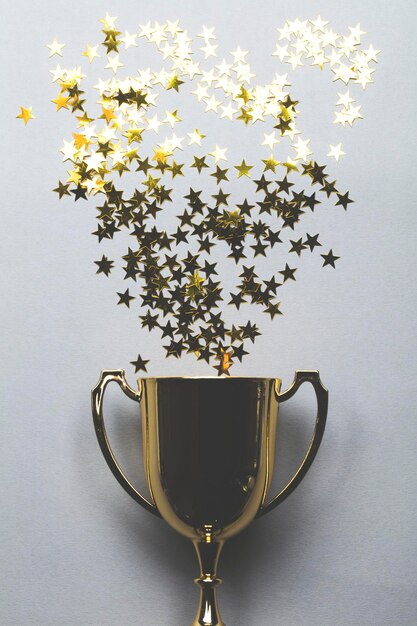 Photo gold winners trophy with golden shiny stars